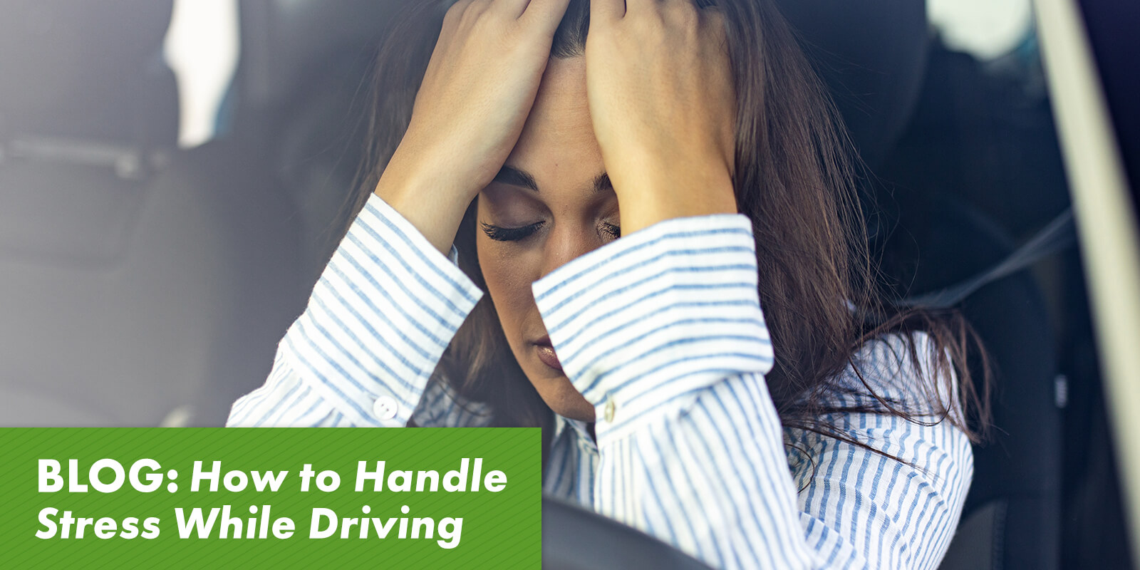 How to Handle Stress While Driving - An image of a woman in a car holding her hands to her head, indicating she is stressed out.